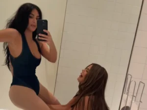 Kim-kardashian-sister-helps-kim-bodysuit-bathroom-video-